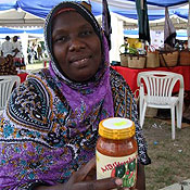 Fatma Ali Said holds a jar of mango pickle sauce 