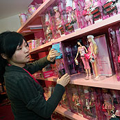 A Chinese worker at the Barbie store in China 