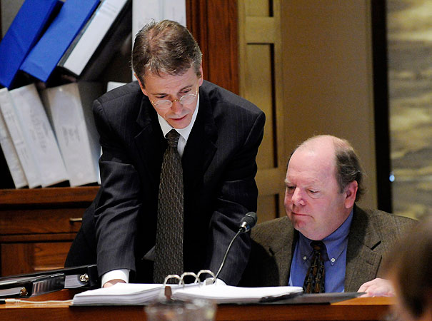 Al Franken attorney Kevin Hamilton, left, looks over an exhibit with Joe Mansky, election director for Ramsey COunty during the Senate vote recount trial Friday, March 6, 2009 in St. Paul, Minn.