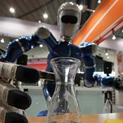 A Rollin Justin robot prepares to mix instant tea 