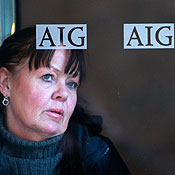 A woman walks out of the AIG offices in New York 
