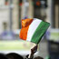 An Irish flag being waved in the air