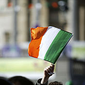 An Irish flag being waved in the air 