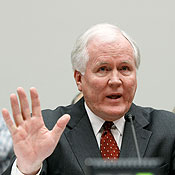 AIG CEO Edward Liddy testifying before a committee 