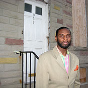 Donald Greshman stands in front of his row house slated for demolition to create the "new" East Baltimore.