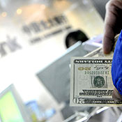 Customer exchanges U.S. dollars at a Chinese bank 