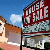 A for sale sign in front of a home in Miami 