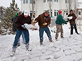 Volunteers build a sandbag levee