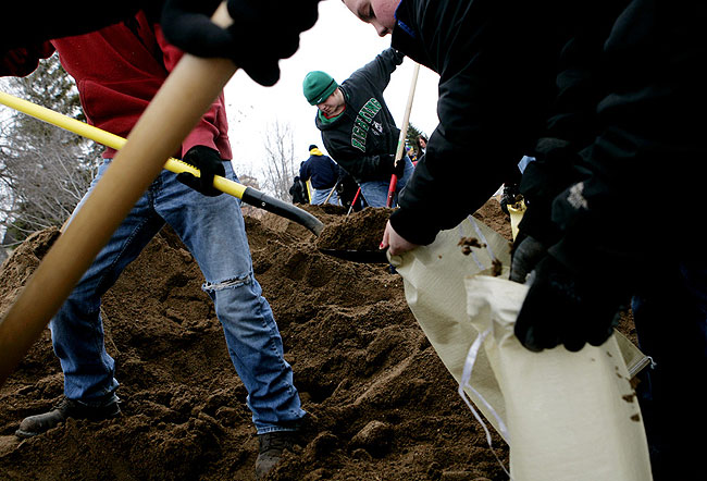 Students from Ada filled sandbags by hand on Main Street in Hendrum, Minnesota Monday, March 30, 2009.
