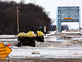 Military vehicles naviate over flood waters