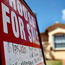 A for sale sign in front of a home in Miami