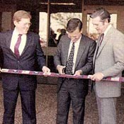The ribbon-cutting for Citibank offices in Sioux Falls in 1981. From left: Gov. Bill Janklow, Citicorp CEO John Reed, Citibank President and CEO Dick McCrossen. The ribbon was decorated with credit cards.