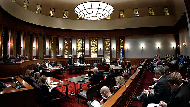 Minnesota State Elections Director Gary Poser (center), sorted through nearly 400 additional absentee ballots at the Senate recount trial in St. Paul, Tuesday, April 7, 2009.
