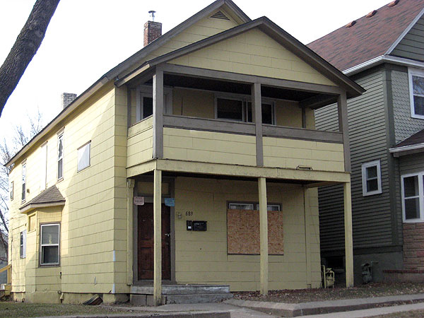 This boarded up house in St. Paul is one of about 2,000 vacant and foreclosed homes on the city's east side.