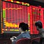 Investor knits at Beijing securities exchange