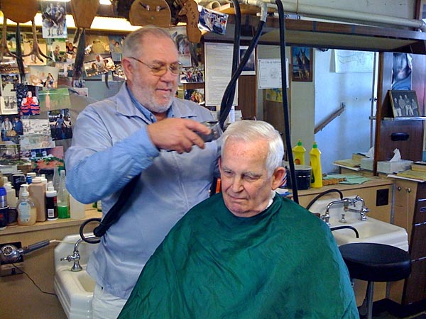 
                Barber Rich McCarty cutting Bob Semb's hair at his barbershop in Jefferson City, Mo.
                                    (Tess Vigeland)
                                