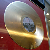 A gold record in a glass case 