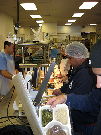 
                Volunteers and paid contractors prepare meals for St. Vincent Meals on Wheels clients.
                                    (Caitlan Carroll/Marketplace)
                                
