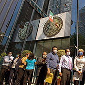 Mexicans await outside their offices 