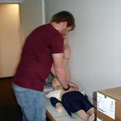 Medical student Elias Scaparro honing his resuscitation skills on a dummy --- one of the pieces of equipment bought with tuition fees.