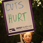 A senior protests health care program cuts 