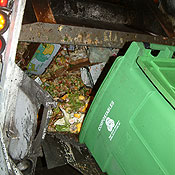 Food for composting is dumped into a truck 