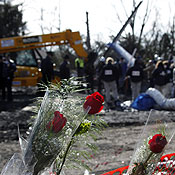 Flowers left in memorial at a plane crash site 