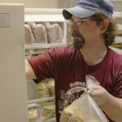 Tom Schroeder owns the Danish Baker in Dannebrog, Neb. It's a coffee shop, restaurant and card parlor all rolled into one. He's concerned about having to drive 15 to 25 miles to make a deposits, especially after his popular pizza nights.