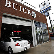 A car pulls into a Buick dealership 