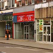 A shopper walks on Kilburn Road in London 