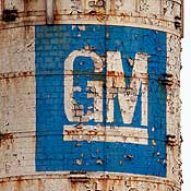 Paint peels from a shuttered GM assembly plant 