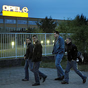 Workers at an Opel plant arrive for work 