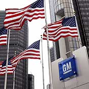 Flags fly outside the GM headquarters 
