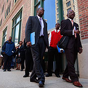 Job seekers wait in line for a job fair in Chicago 