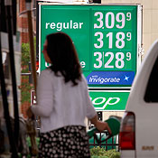 A motorist fills her SUV with gas in Chicago 