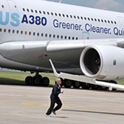 A pilot runs in front of an Airbus A380 