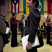 Job seekers wait in line for a job fair 