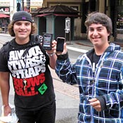 Drake Kemper, left, and Noah Sall with new iPhones 
