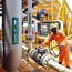 A worker inspects an oil drilling platform