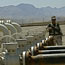 An Iraqi Kurdish soldier guards an oil field