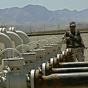 An Iraqi Kurdish soldier guards an oil field 