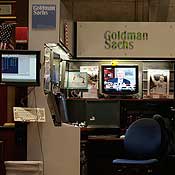 A TV plays at the NYSE Goldman Sachs booth 