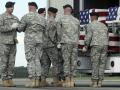 An Army carry team carries a transfer case