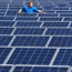 A technician checks solar panels