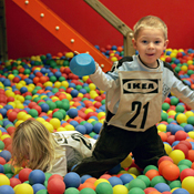 Children play in a ball pit at Smaland 