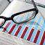 Investor's glasses on reports.