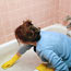 Maid cleaning tub.