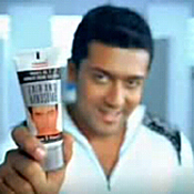 Indian actor Surya with a bottle of Fair & Handsom 
