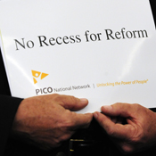 Man holds a health-care reform sign 