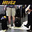 Customers at a Hertz counter